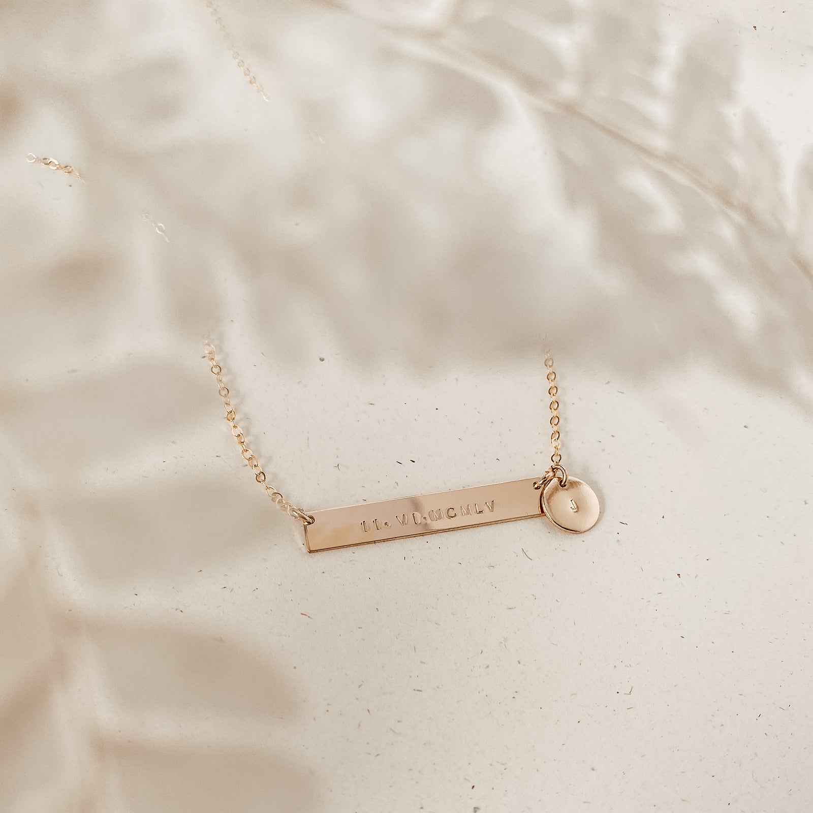 Personalised jewellery - KBN Jewellery - handmade jewellery – Personalised Jewellery gifts – Dainty jewellery- bar necklace – dainty bar necklace – personalised date necklace – roman numerals necklace – name bar necklace – words of affirmation necklace – long bar necklace – layering necklace – layering necklace inspiration – wedding gift idea – wedding gift idea for bride  - long pendant necklace with additional small pendant – unique necklace – personalised bar necklace