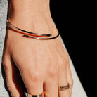 gold initial bangle being worn