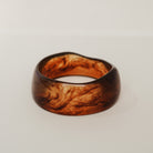 Wooden ring with a natural grain pattern on a light gray background - KBN RESIN BANGLES