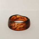 Wooden ring with a natural grain pattern on a light gray background - KBN RESIN BANGLES